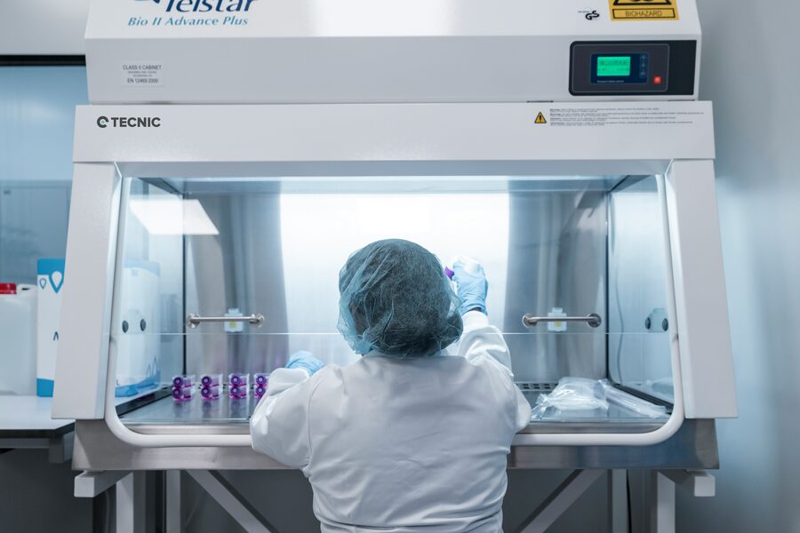 Pharmacist preparing a sterile compound in a certified cleanroom